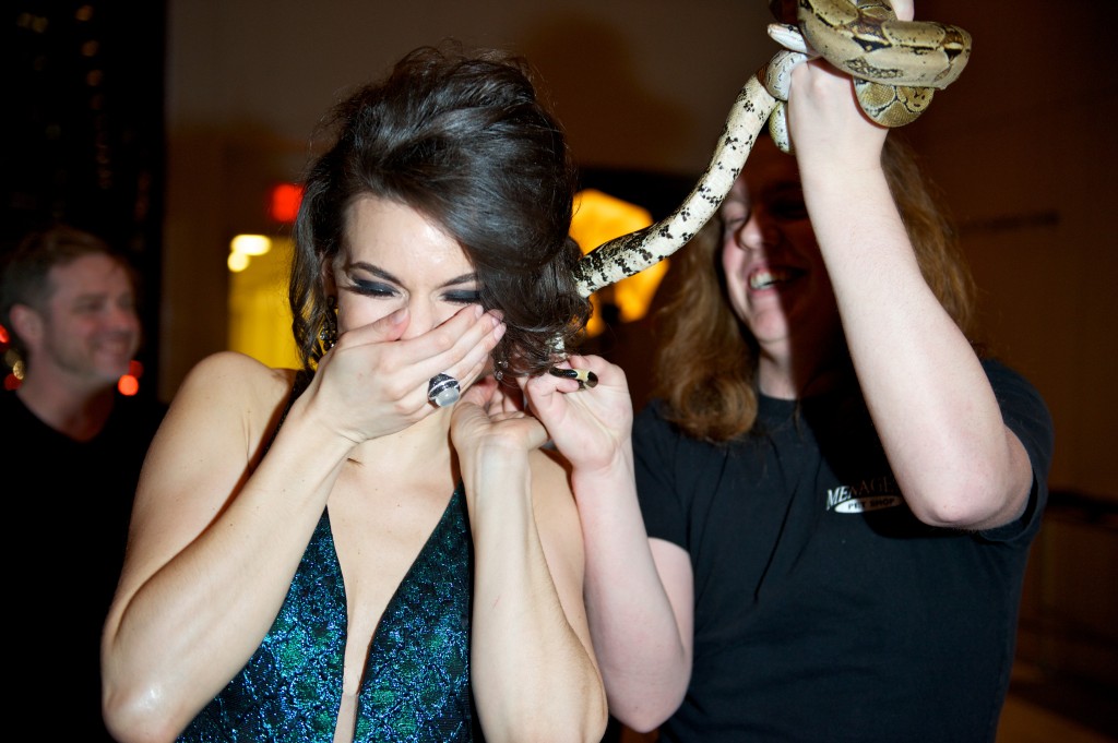 Ambur Braid sports a Medusa hairstyle as the boa snake gets tangled in her hair (photo: Ryan Emberley) 