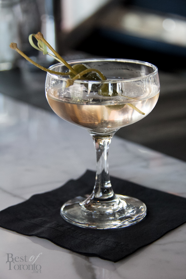 Gin Martini. Gin, Dry French vermouth, drowned caper berries each with blue cheese