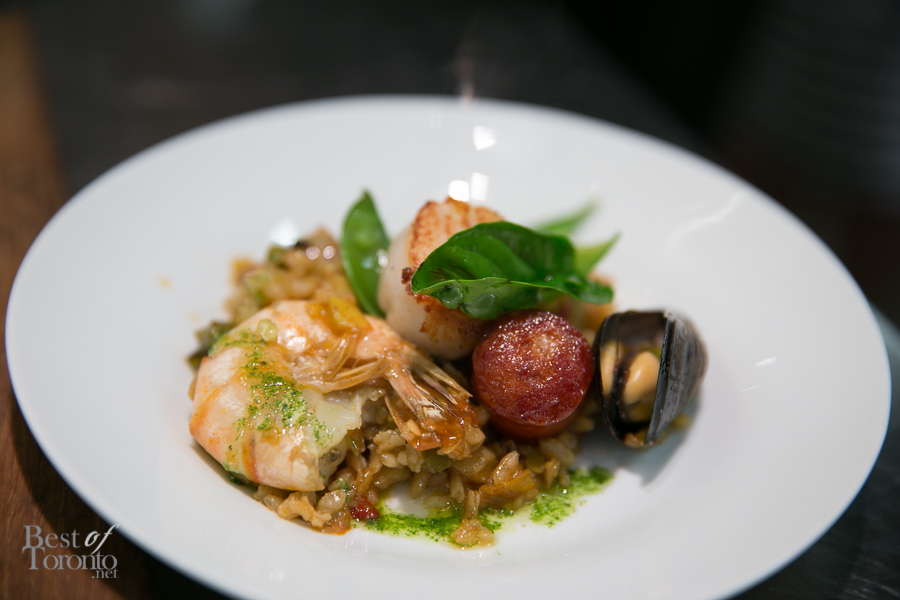 Valencian Spanish paella with baby clam, mussel, calamari, shrimp, chicken and grilled chorizo