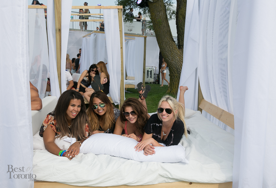 Enjoying the full VIP service in a cabana bed