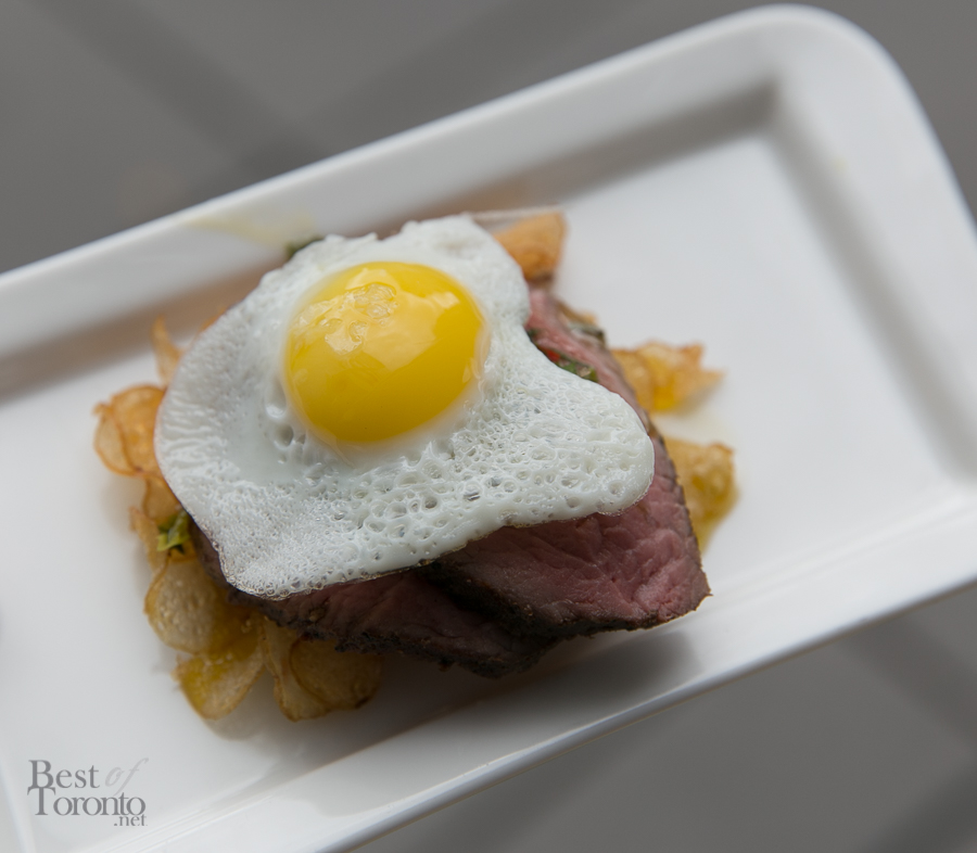 Quail eggs and steak on house made kettle chips