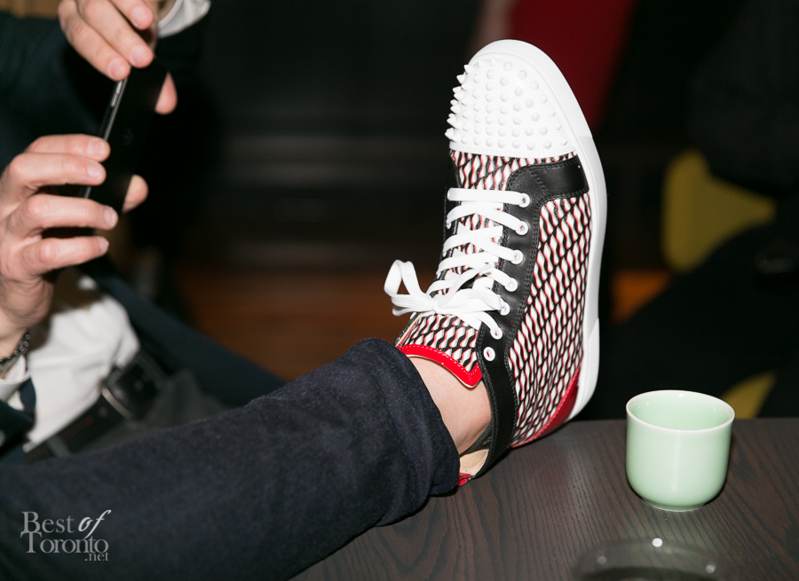 Chef Alvin Leung's Christian Louboutin sneakers. Michael Bonacini snaps a photo with his phone. Photo: Nick Lee