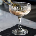 Gin Martini. Gin, Dry French vermouth, drowned caper berries each with blue cheese