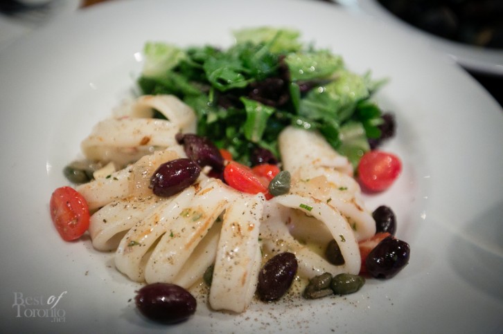 Grilled calamari with caramelized onions, kalamata olives, capers, local grape tomatoes, roasted garlic