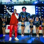 Kardinal Offishall on stage with the Argos cheerleaders