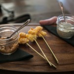 Deep fried shrimp fritters with hot sauce and garlic aoili sauce