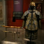 The Emperor's Ceremonial Armour and sabre from the Qing dynasty (Yongzheng period). It features cotton padding, embroidered silk satin, copper studs, and metal plates. meant for show rather than real protection.