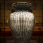 "Jar with Thousand Shou Characters" made of porcelain with underglaze blue. It signifies a wish of 10,000 years of longevity which could only be given to the emperor. This vase was received by Emperor Kangxi on his 60th birthday.