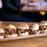 Pulled pork sliders marinated in Lou Dawg's BBQ sauce
