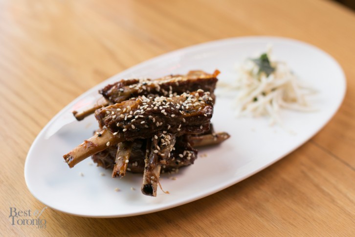 "Saucy Rib 'Nibblers" made with Ontario lamb ribs, sweet hoisin BBQ sauce, sprinkles of sesame seed and celeriac slaw