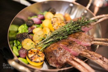 Whole roasted Ontario rack of lamb with morels, fava beans, onions, potato, yogurt and mint.