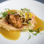 "Lime Leaf-Sesame Fried Chicken" with Lobster mash, Khao Soy curry, bacon-apple heirloom beet slaw