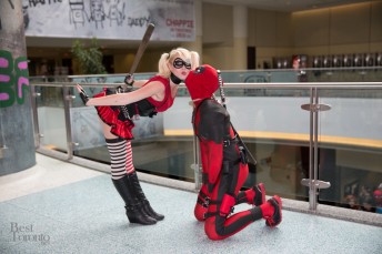 Harley Quinn and Deadpool share a moment with a bat