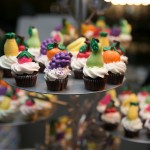 Mini cupcakes with vanilla icing and hand-painted chocolates by Lollicakes | Photo: Nick Lee