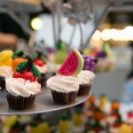 Mini cupcakes with vanilla icing and hand-painted chocolates by Lollicakes | Photo: Nick Lee
