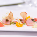 Hamachi Crudo with shaved fennel, fresh citrus, puffed rice and drizzled with olive oil