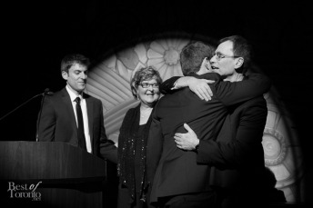 Adam Panov hugging his father, Yaron Panov after a heartfelt speech.