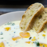 Vegetarian chowder with corn and squash, and buttered bread