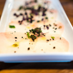 Carpaccio di pesce spada | Swordfish carpaccio with squid ink bread crumb, serrano chili, lemon and olive oil