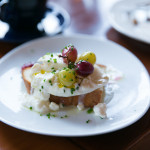 Fresh Ontario Burrata cheese with roasted grapes and toasted bread