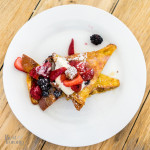 Cinnamon brioche french toast with seasonal fruit, chantilly, candied pecans, local syrup