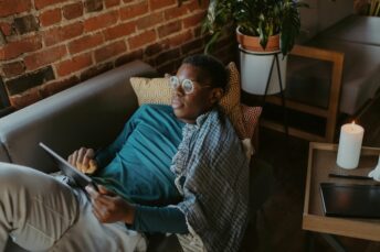 Man using his table on the couch
